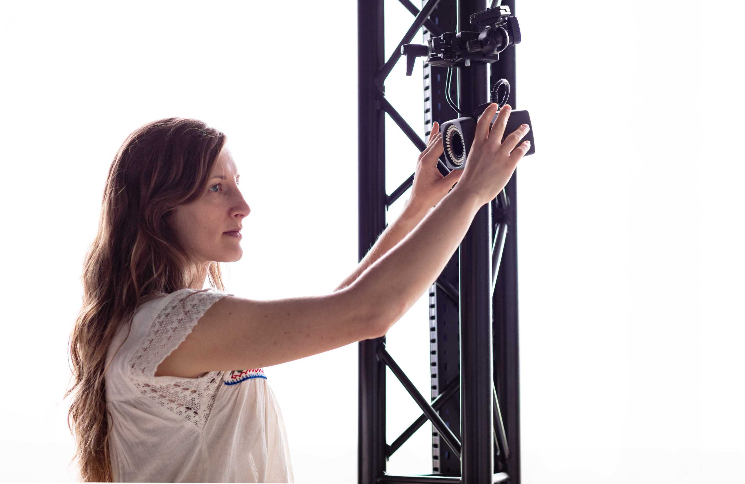 Enlarged view: Person (Aileen Naef) working on a motion capture camera