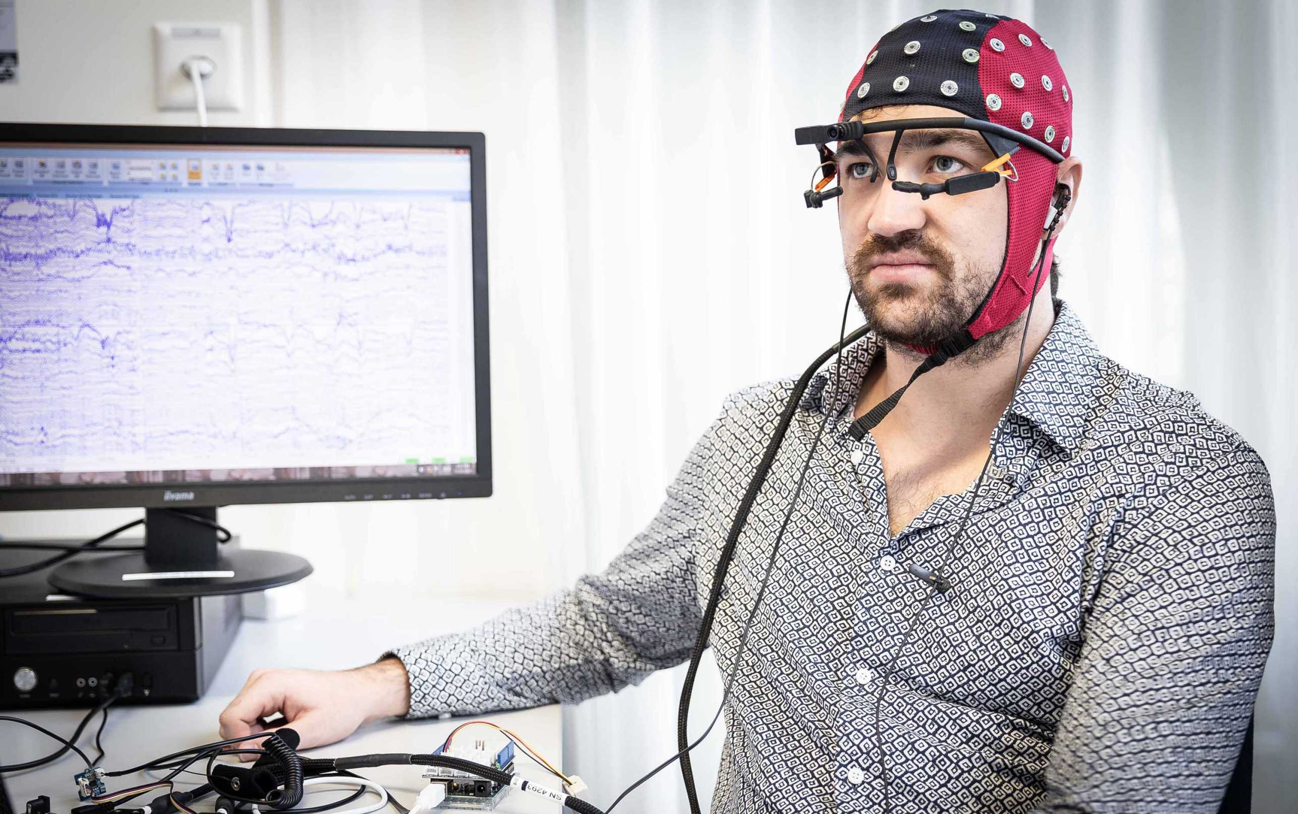 Enlarged view: Dane Donegan with Eye Tracking Glasses and Brain Compute Interface